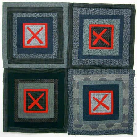 Quilt that's not yet stitched with red 'X' symbols in a grid pattern on a black background