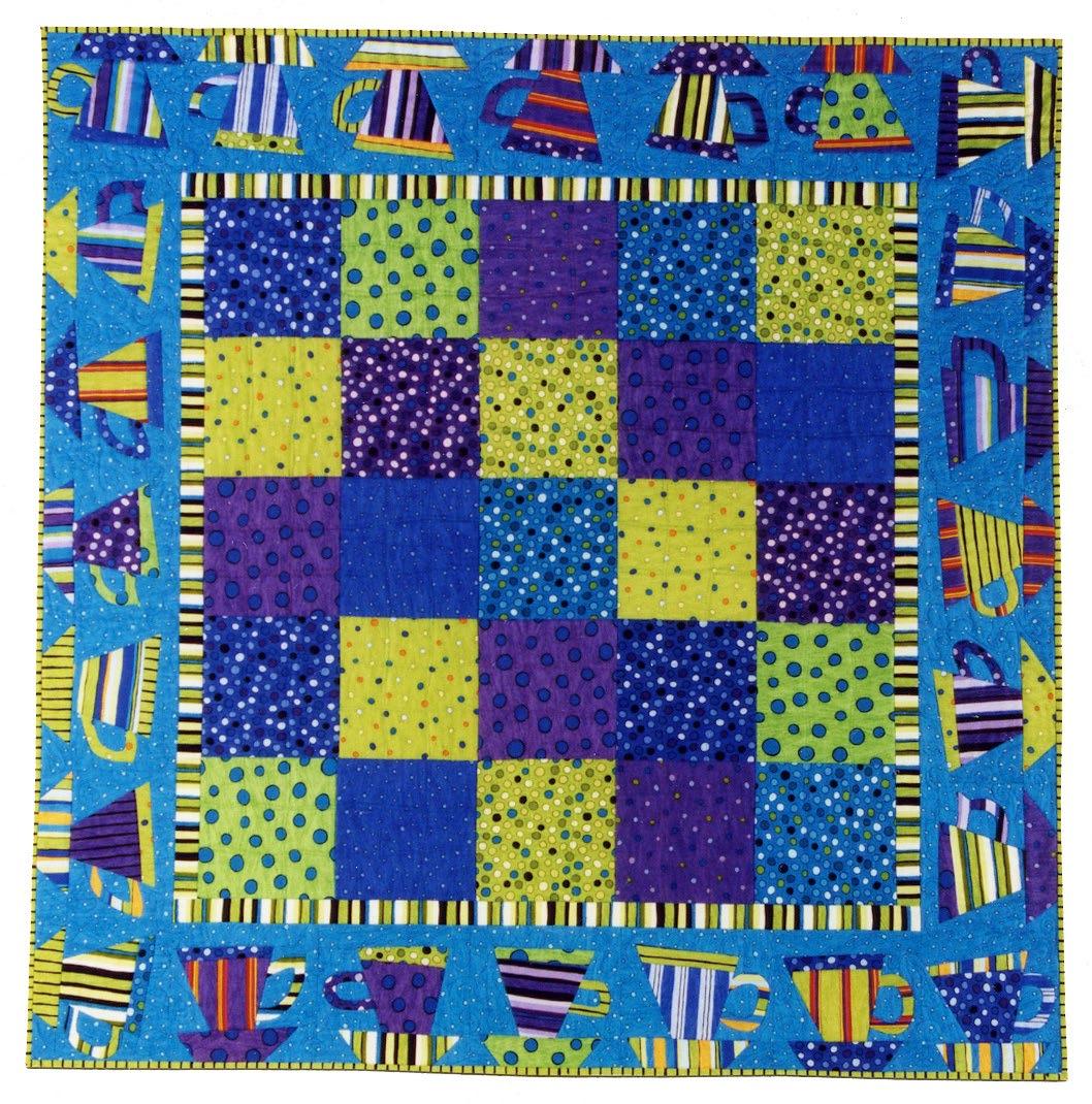 Colorful quilt with patterned squares and tea cup designs on a blue background