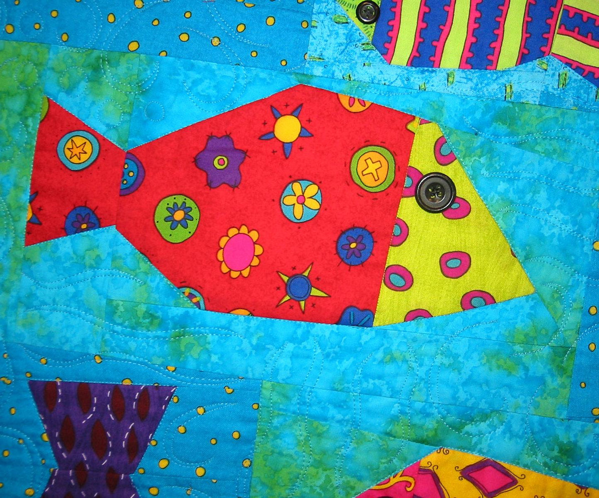 Colorful fish-shaped patchwork design on a blue background