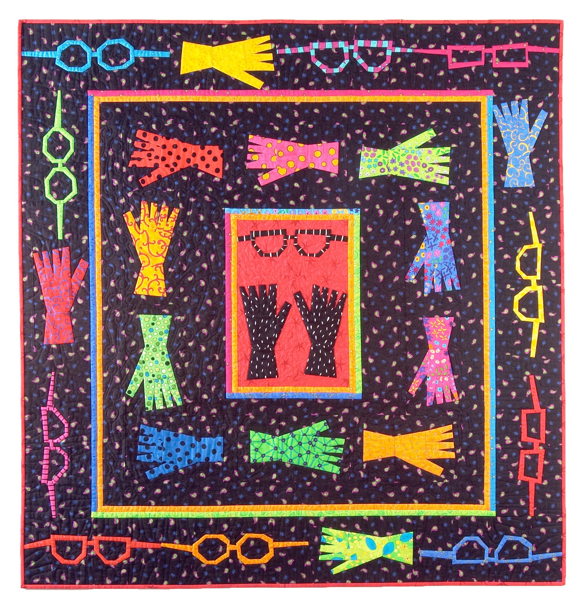 Colorful quilt with patterns of glasses, gloves, and bows on a dark background