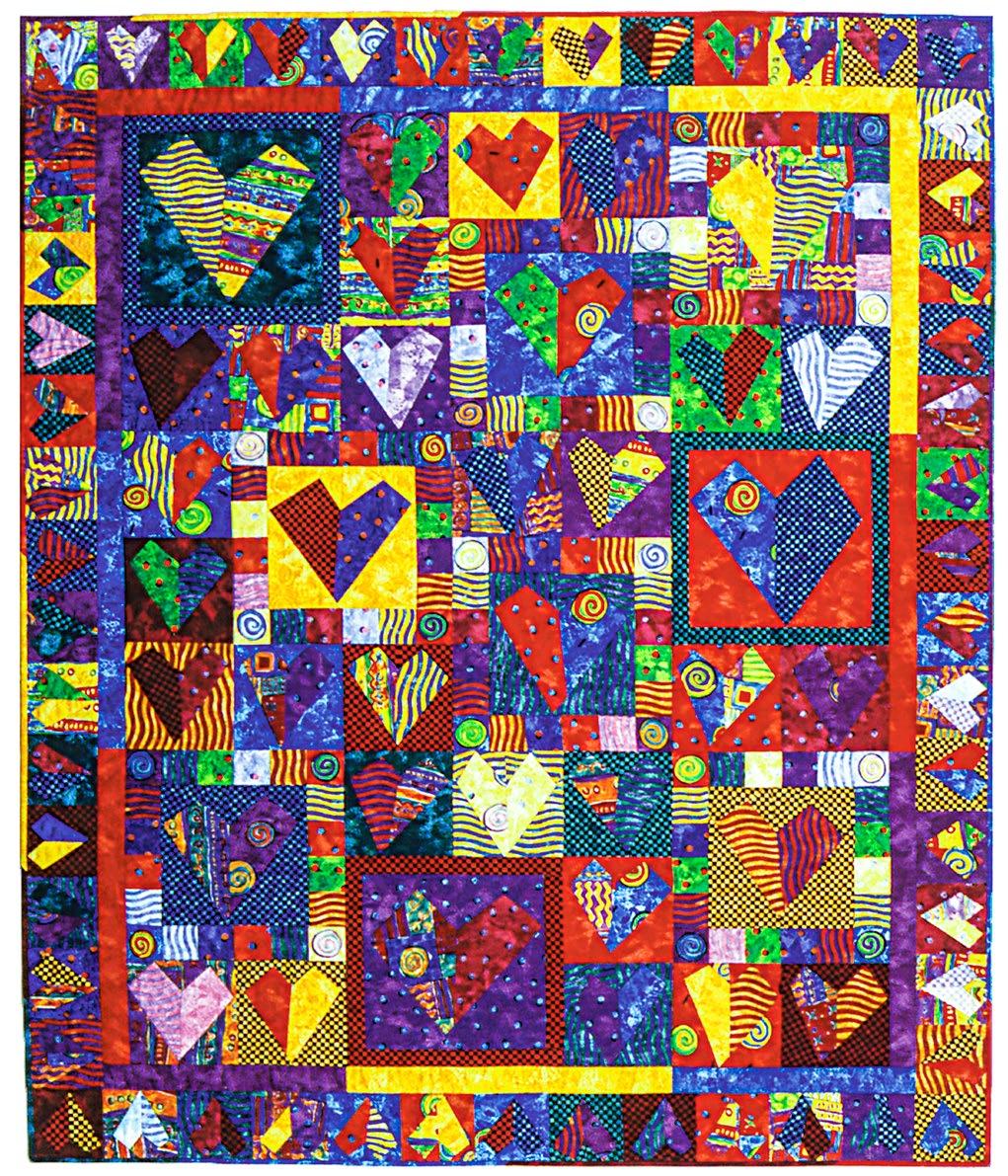 Colorful quilt with heart patterns and geometric shapes