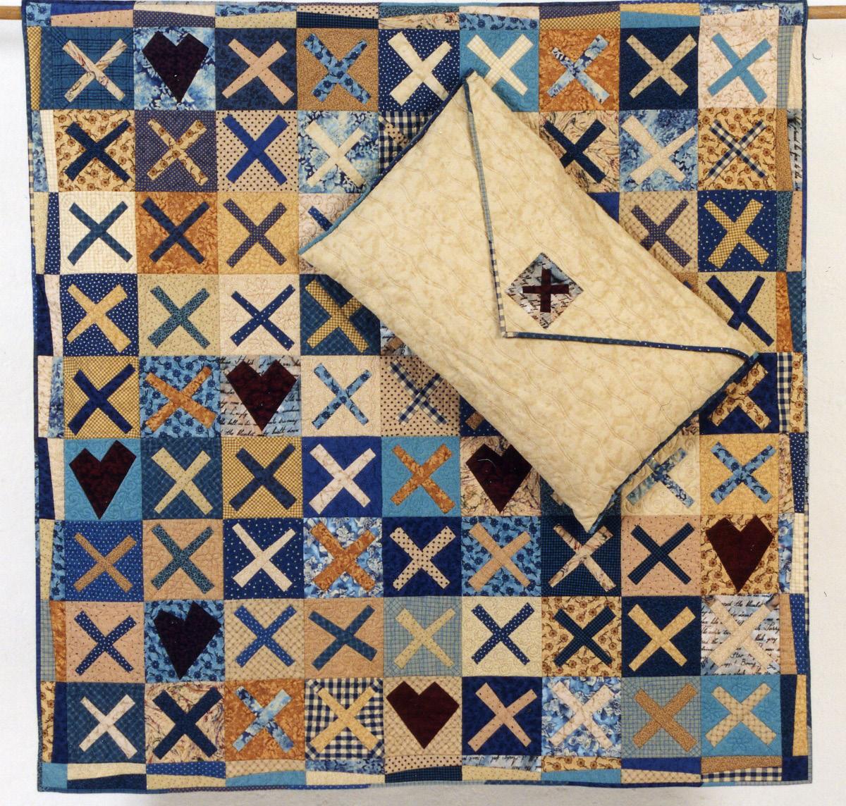 Quilt with kisses plus fabric gifting envelope on a white background