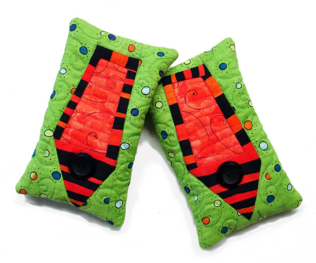 Two green fabric pouches with red and black shoes on a white background