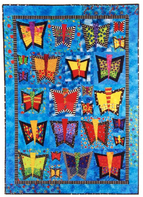 Quilt with a blue background and colourful abstract butterflies in red yellow and black