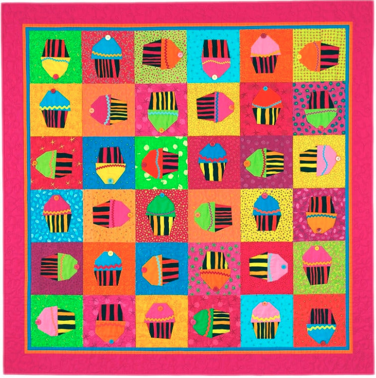 Quilt pattern with colorful cupcake design on a white background, featuring the brand 'Stargazey'.
